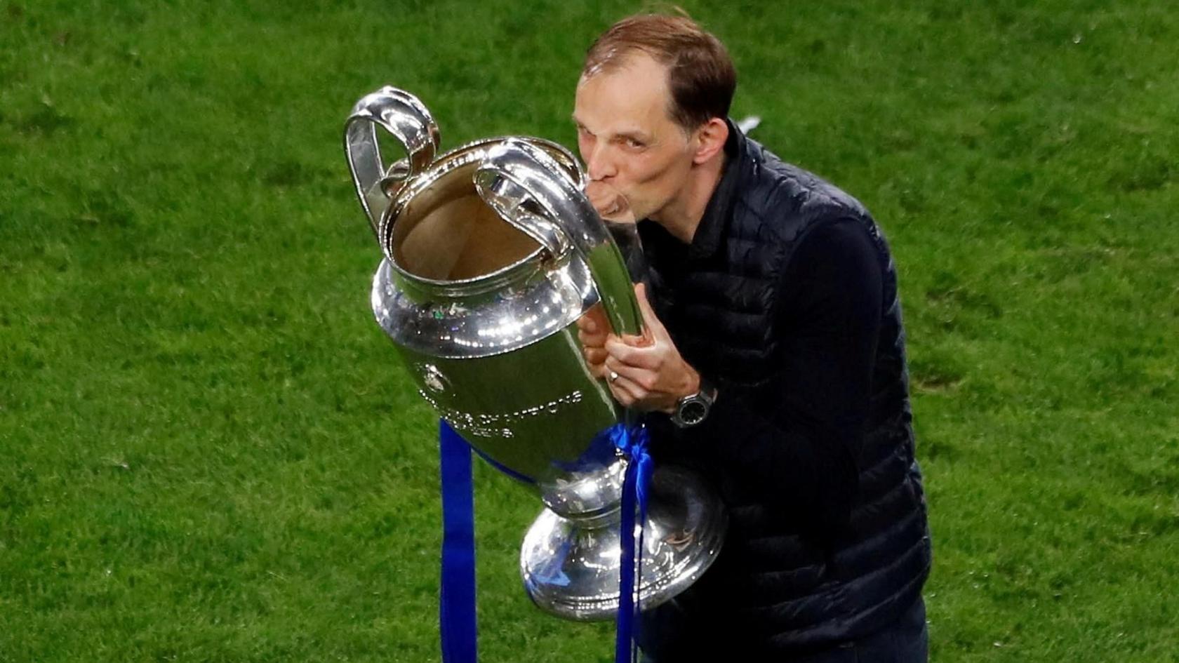 Thomas Tuchel celebrates with the trophy after winning the Champions League Pool while managing Chelsea