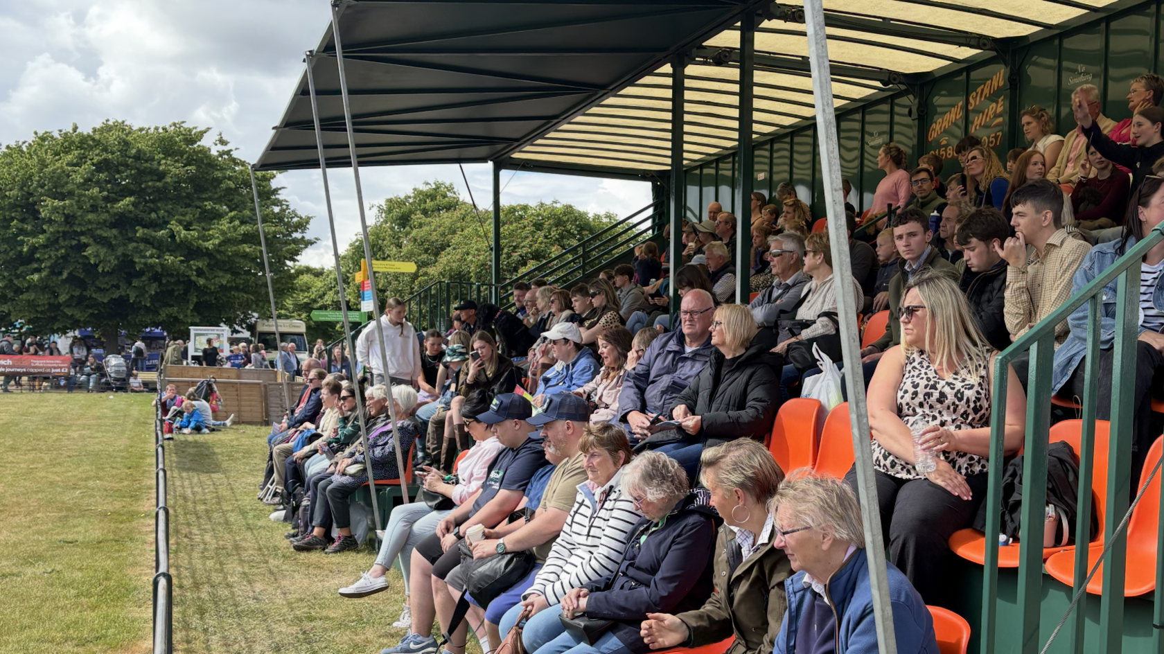 A large stand filled with spectators during a performance at the Suffolk Show.