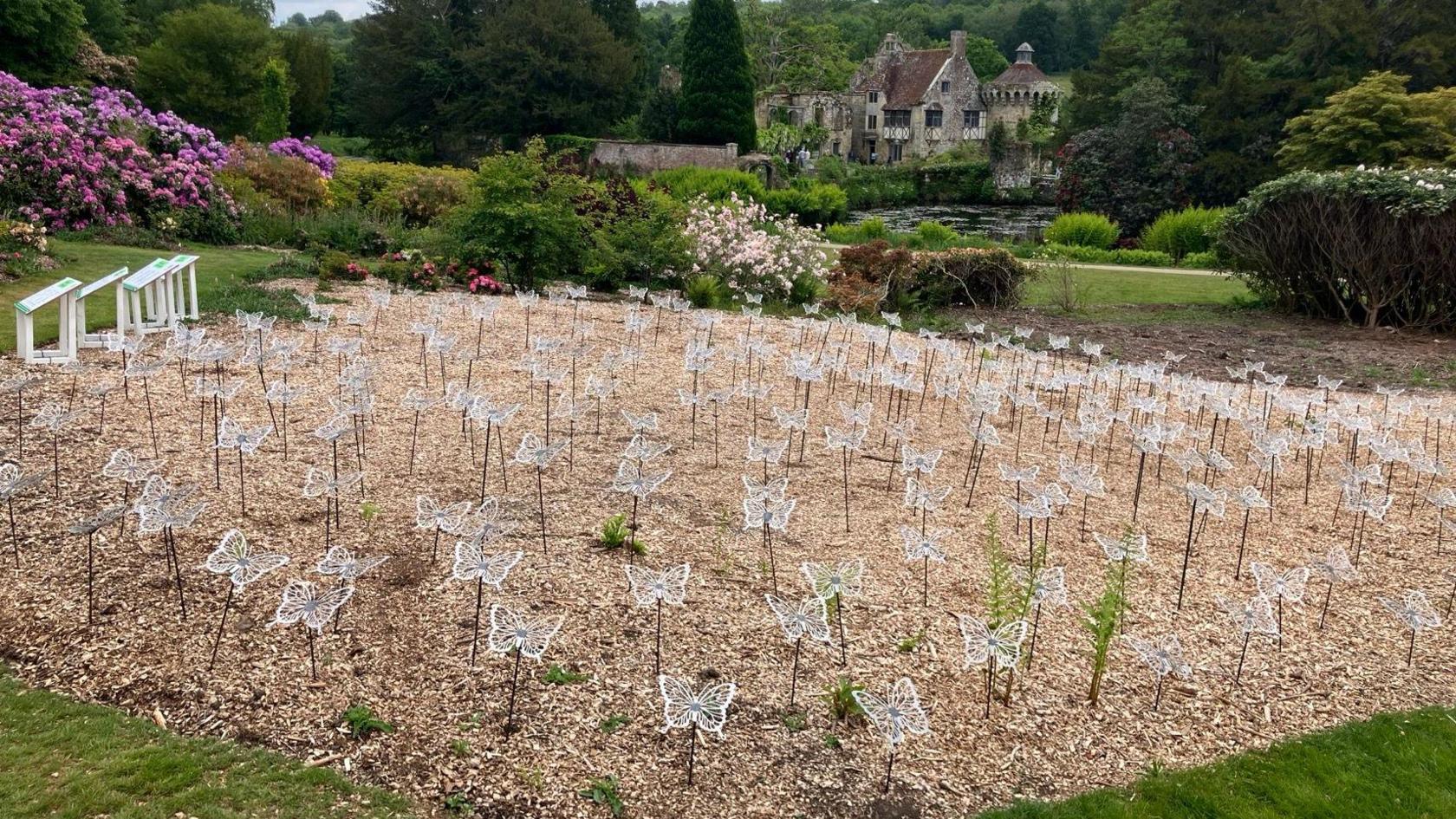 A display of steel butterflies installed at Scotney Castle grounds.