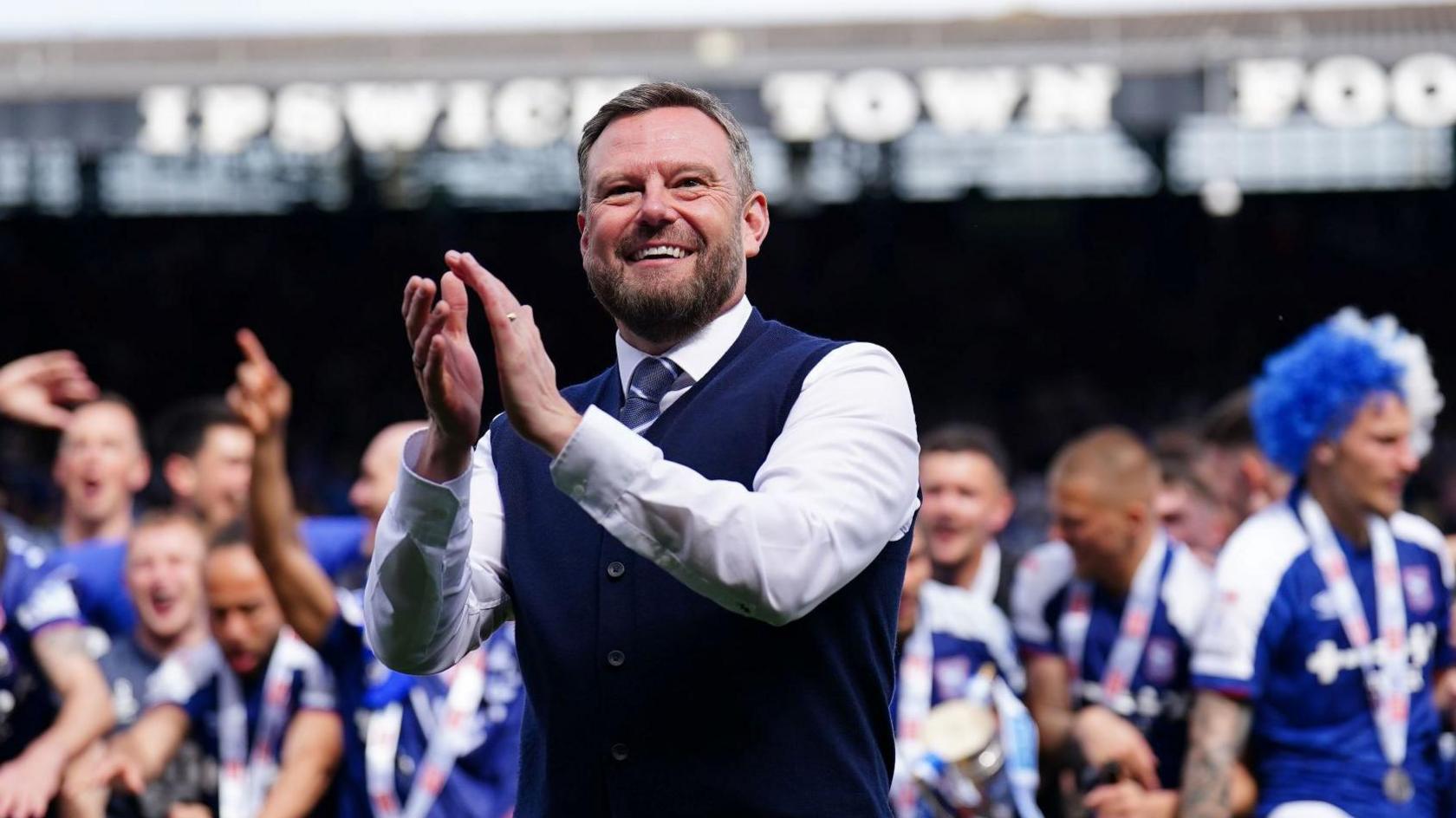 Mark Ashton clapping on the pitch at Portman Road