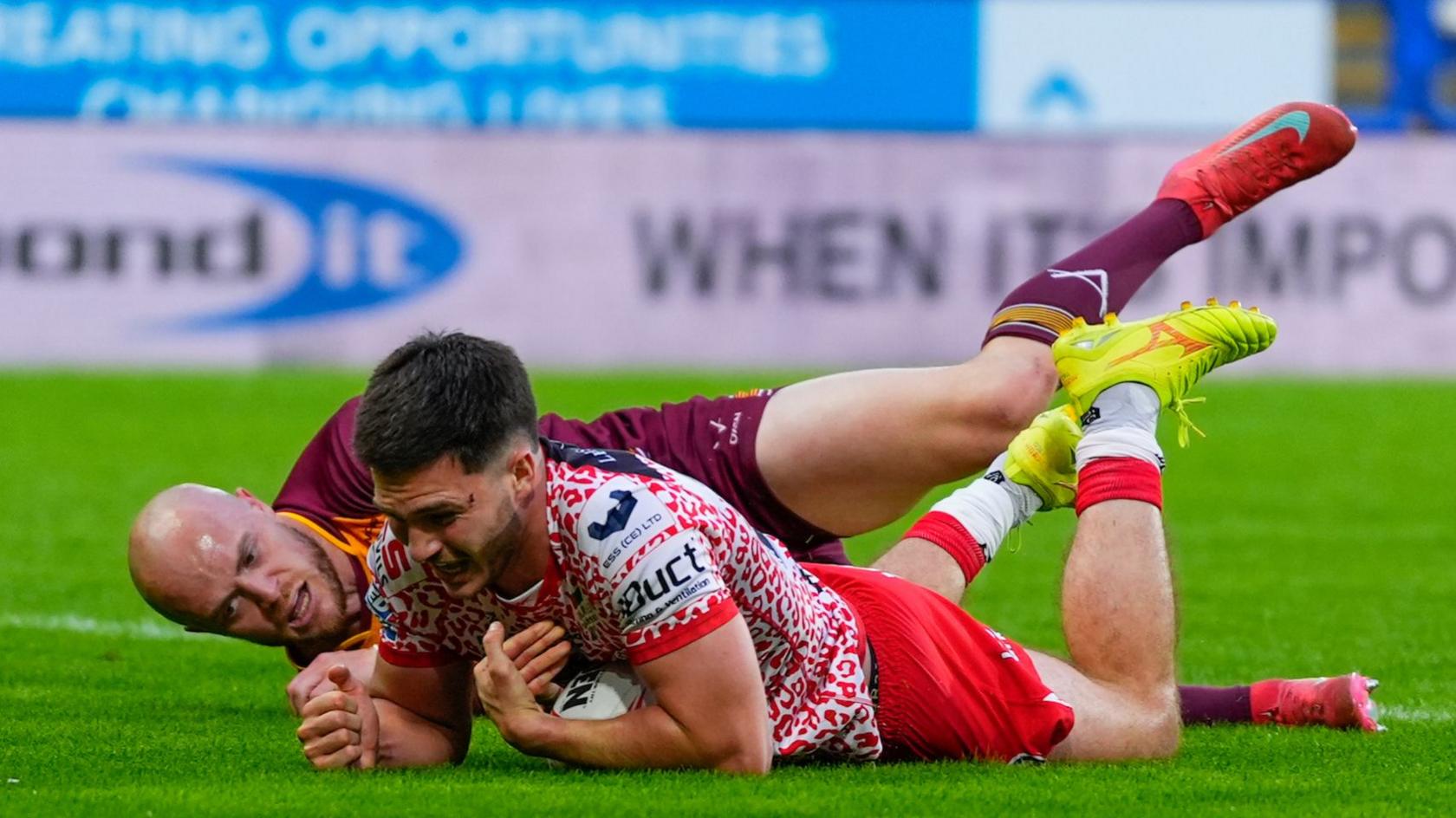 Ben McNamara scores Leigh's second try under pressure from Huddersfield's Adam Swift