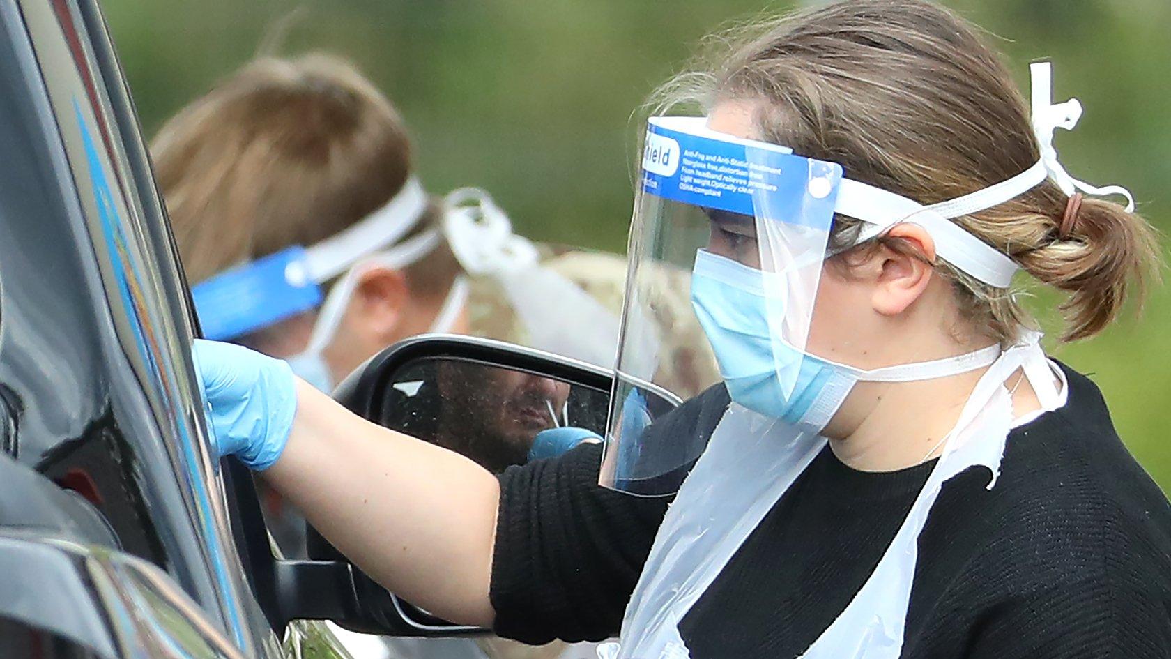 Taking a swab at a drive-through coronavirus testing centre in London