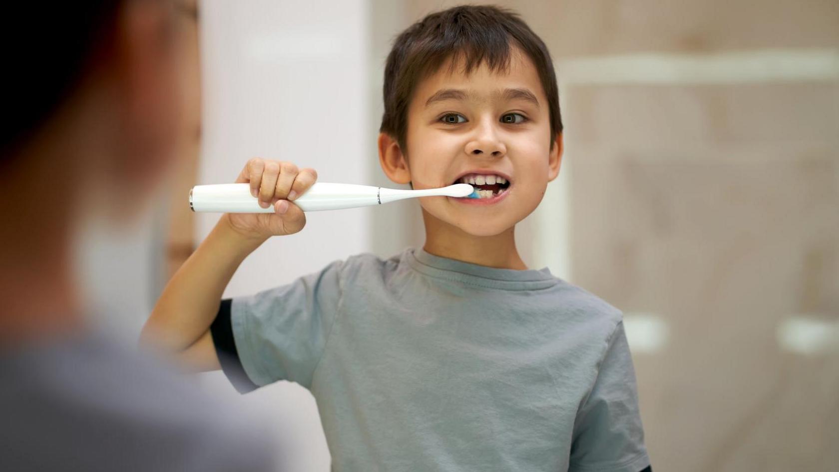 Child brushing teeth