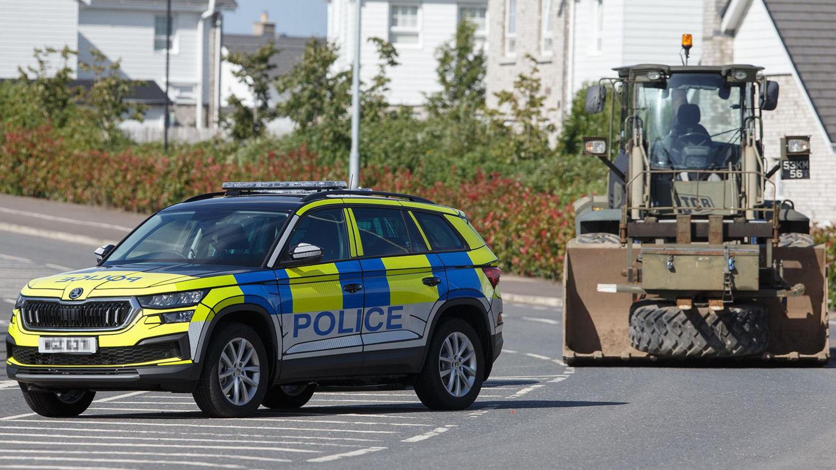 A police car and an army bulldozer pictured in Newtownards.