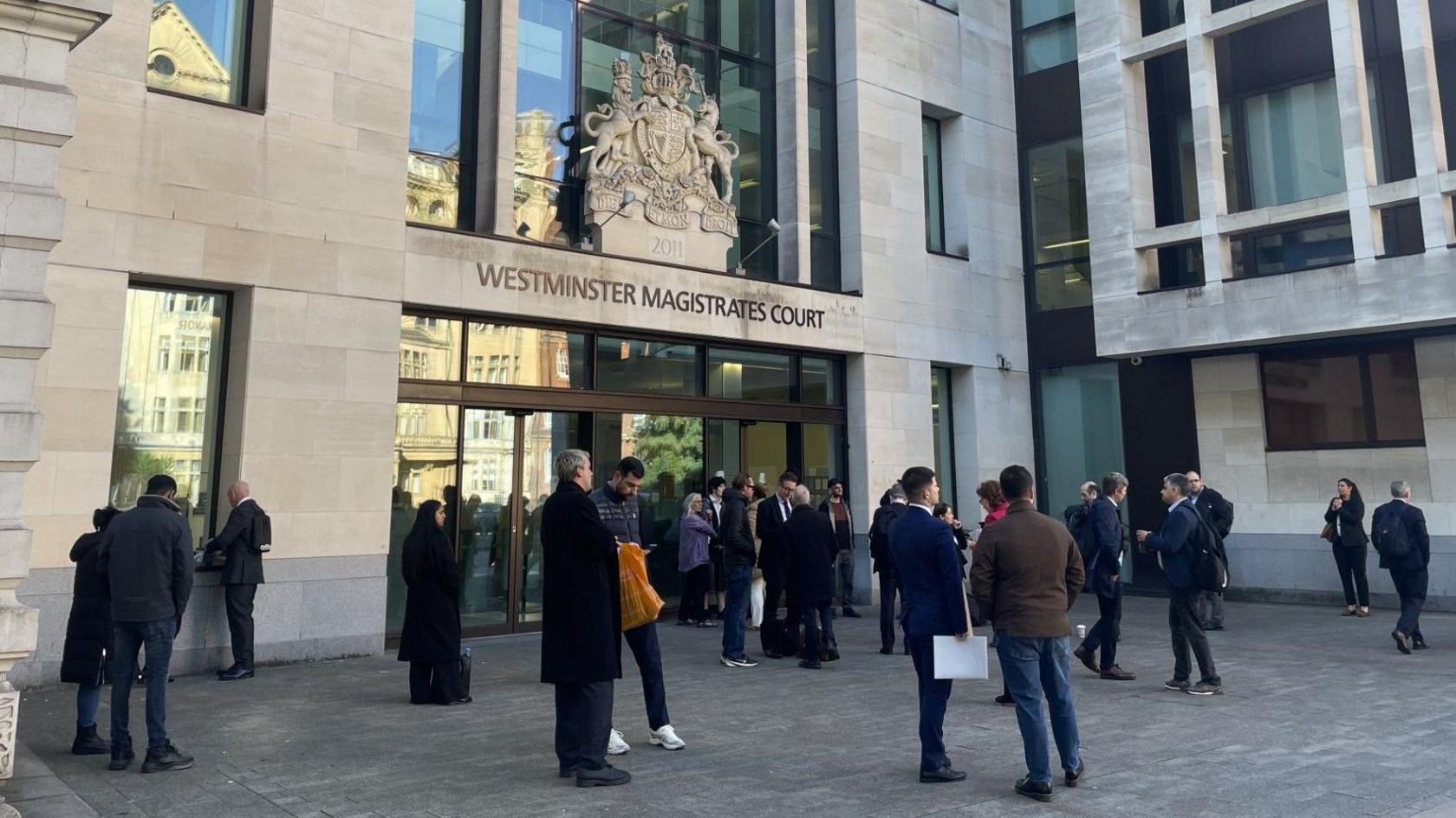 Security staff shut the doors of Westminster Magistrates' Court and lawyers and other court users were seen waiting outside for updates from staff.
