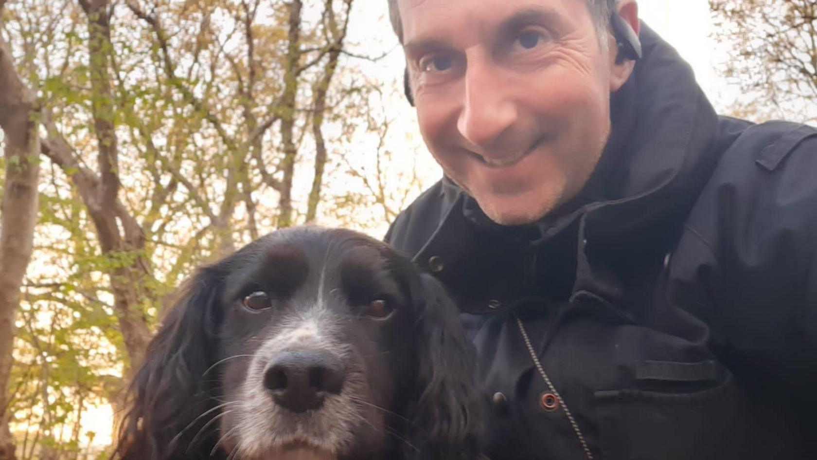 Sherlock the cocker spaniel and his handler.