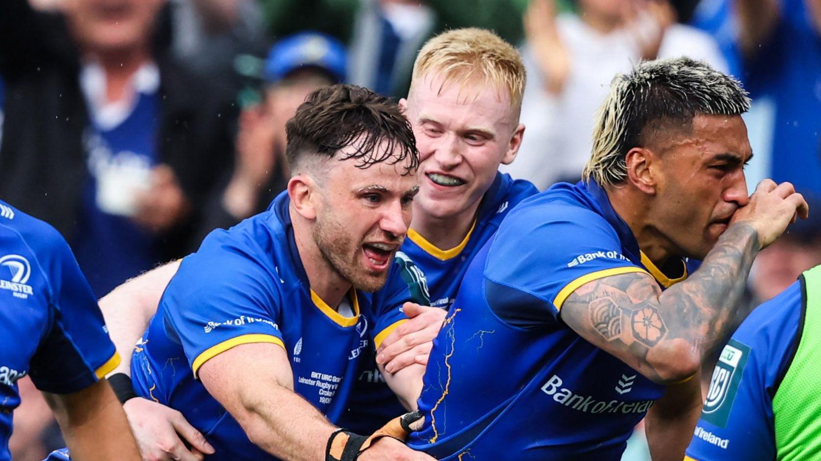 Leinster players congratulate Rieko Ioane