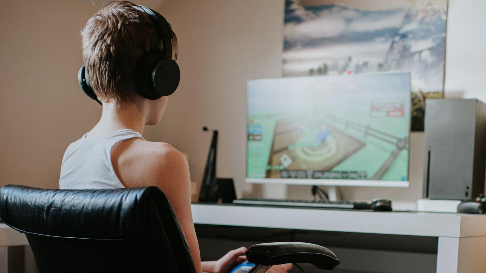 a boy using a gaming pc