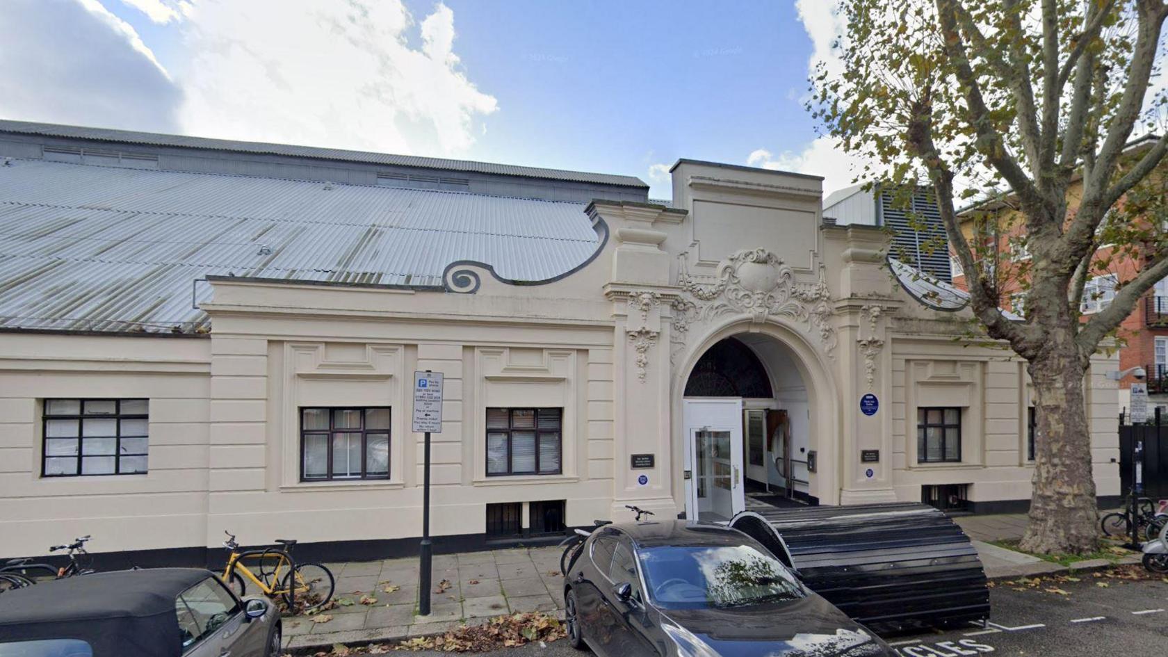 Exterior of the Maida Vale Studios, a white stucco facade with an arched decorative entrance.