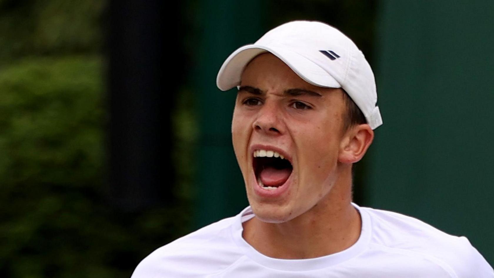 Oliver Tarvet celebrates during Wimbledon qualifying