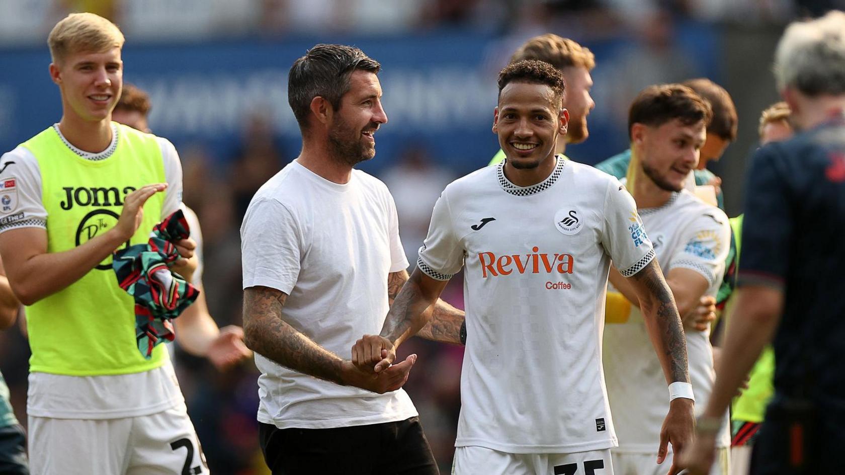Alan Sheehan and Ronald celebrate victory over Sheffield United 
