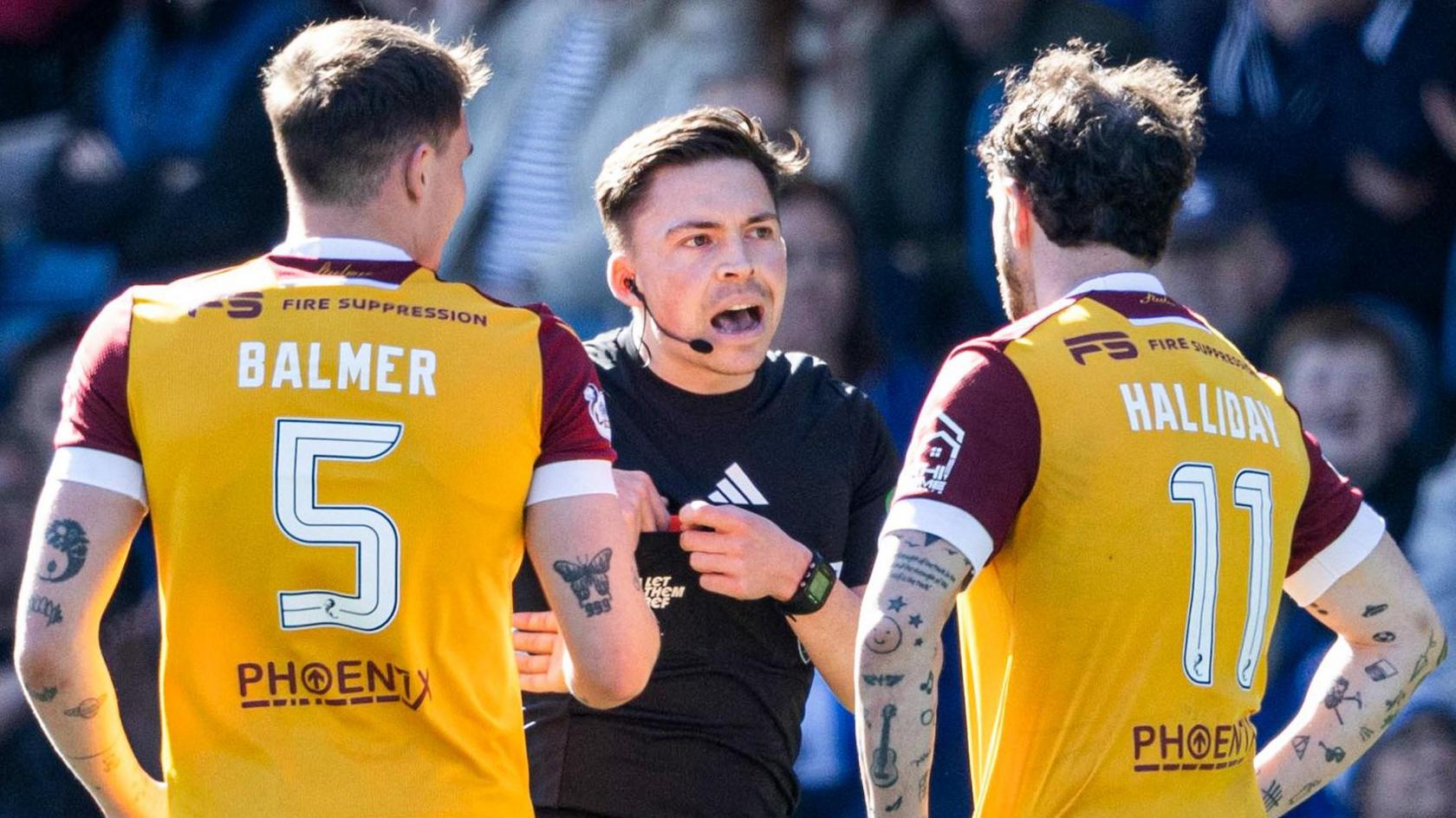 Motherwell players Kofi Balmer and Andy Halliday with referee Matthew MacDermid