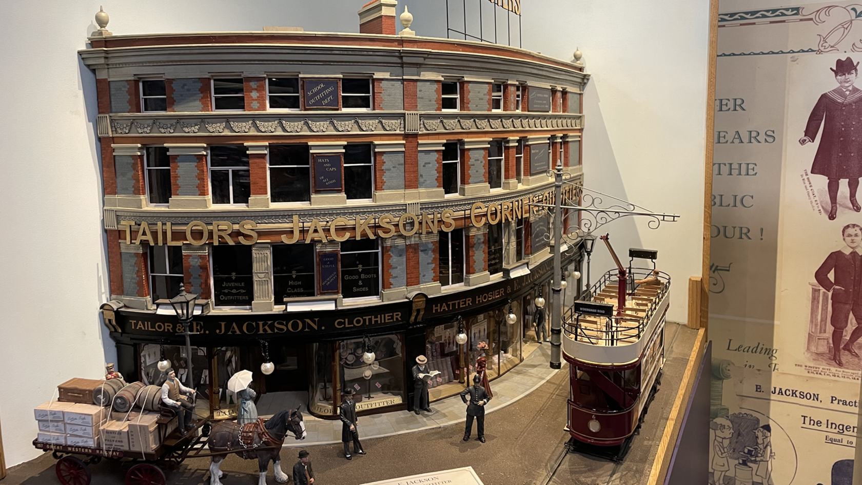 A model of the department store, with a tram running outside
