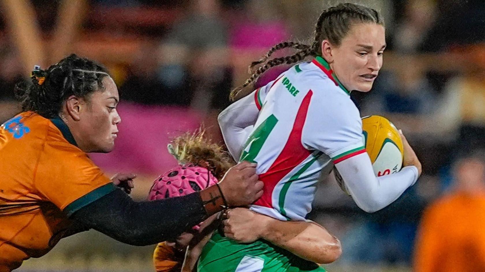 Jasmine Joyce-Butchers (R) is tackled