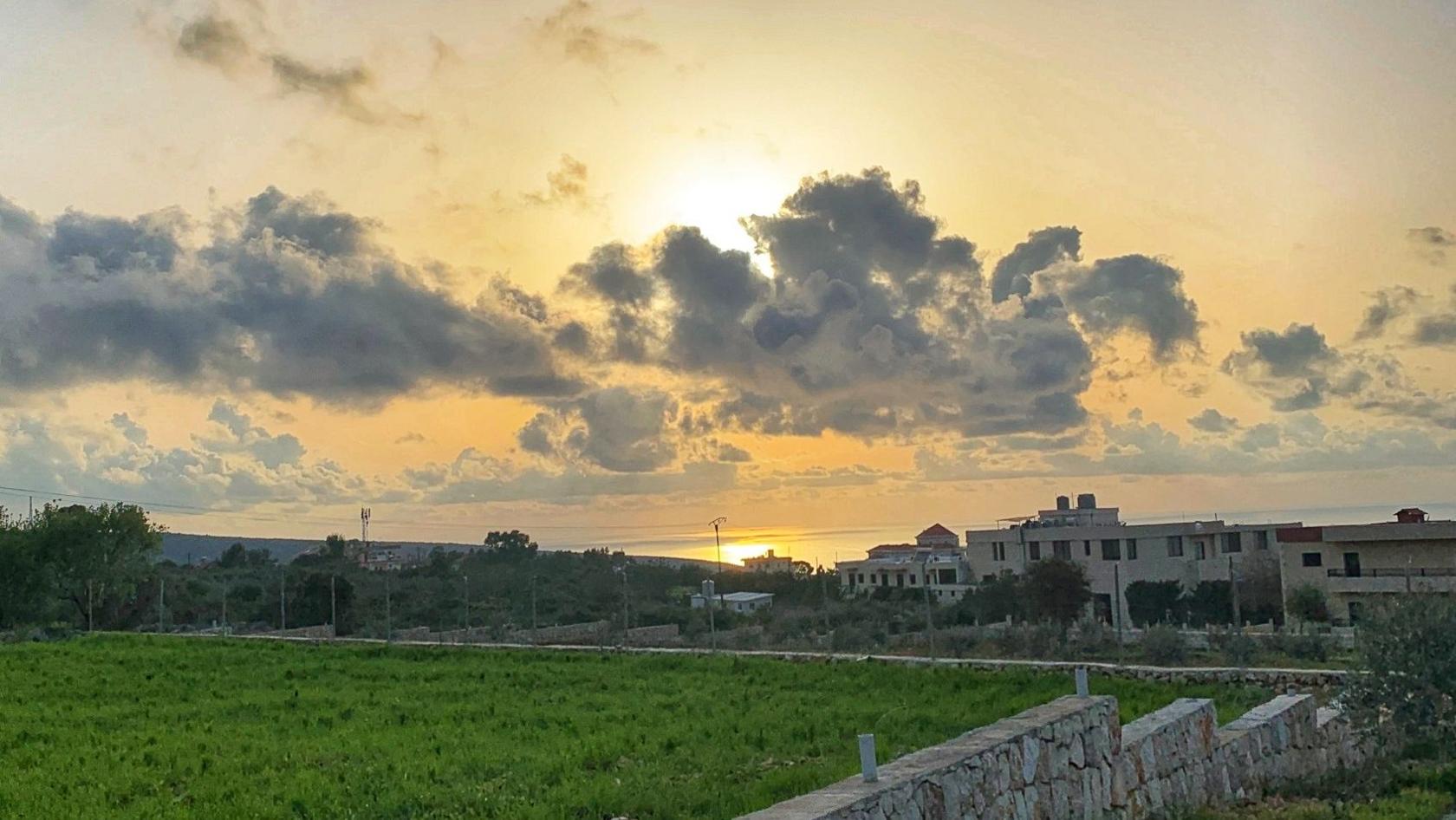 A view of Alma al-Shaab and the surrounding countryside in spring 2020, with the Mediterranean visible in the distance