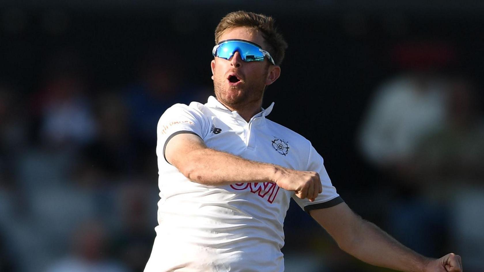 Liam Dawson celebrates his 10th wicket at Old Trafford