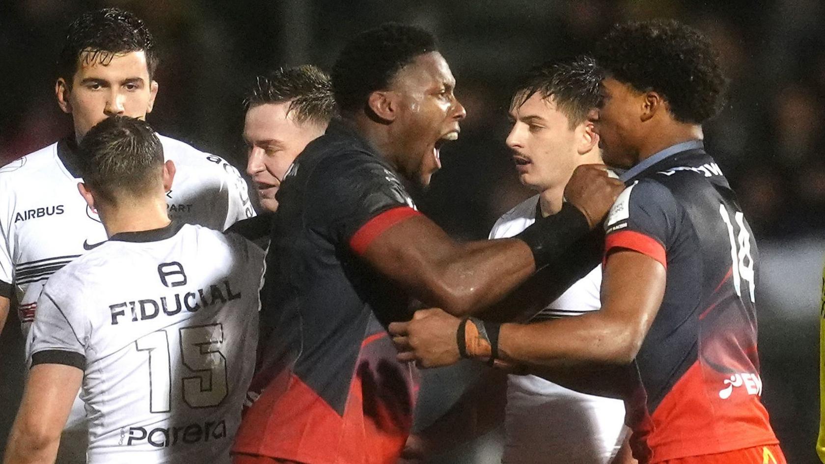 Maro Itoje celebrates with Noah Caluori