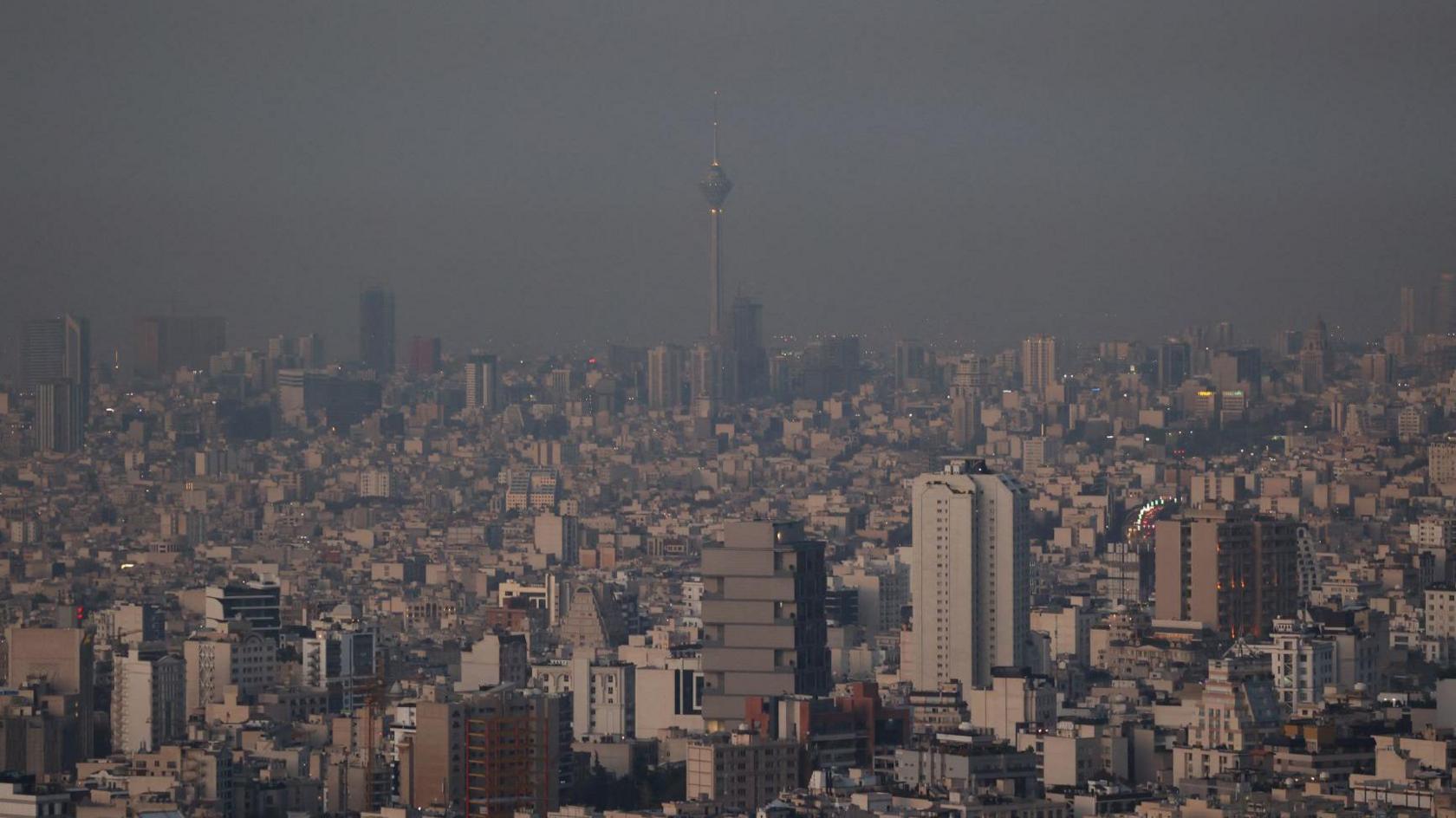 Hazy skyline picture of Tehran on the morning after the strikes