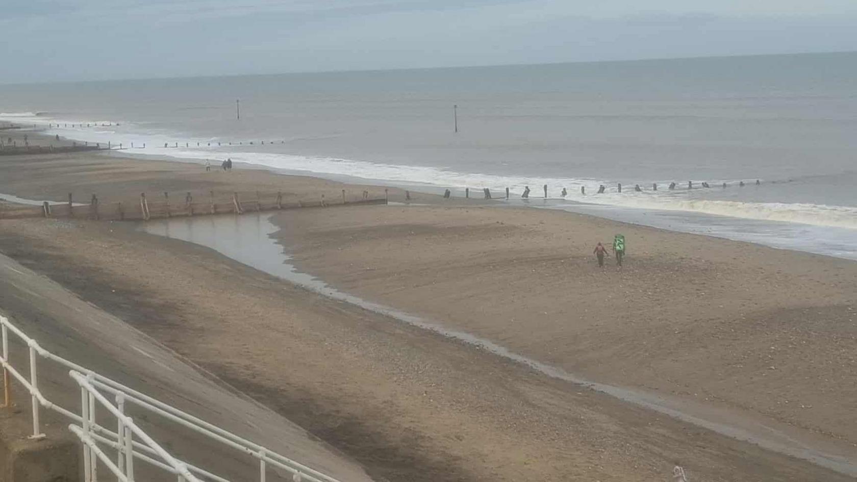 The North end of Withernsea beach that runs along the north side of the Pier Towers. Near the top of the photo is the breakwater where Katy Allinson had been walking. From a distance two people can be seen on the beach.