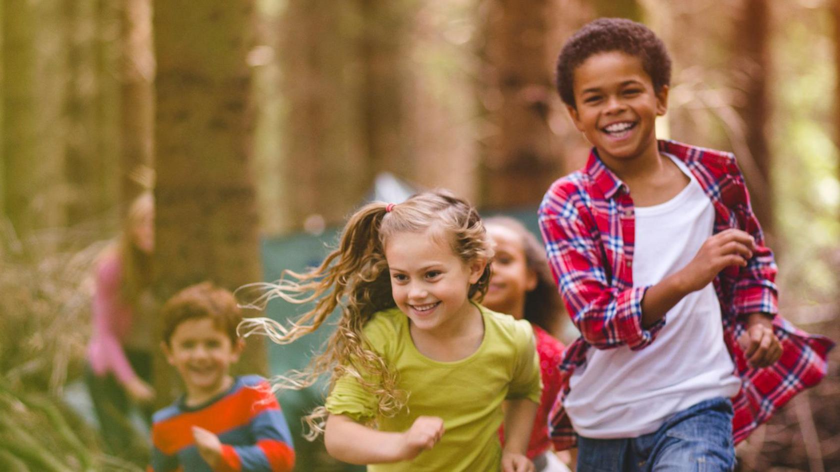 Children running through the woods.