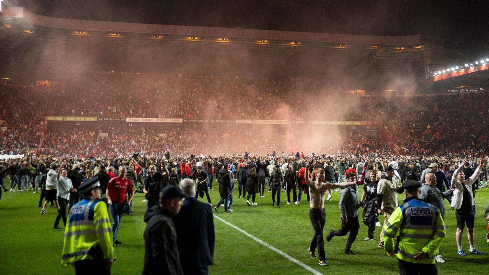 Charlton fans invade the pitch