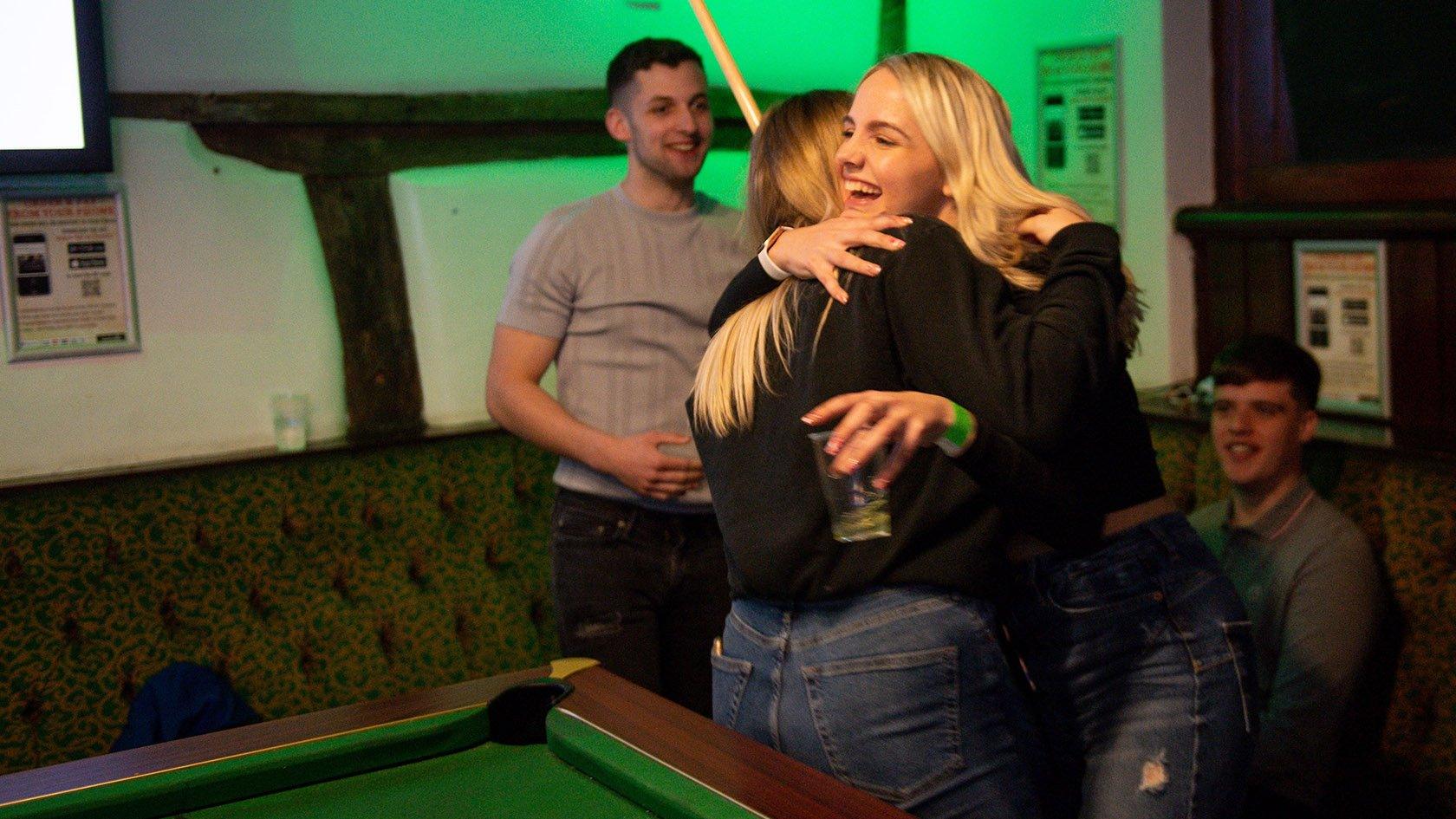 Customers enjoy a game of pool at the The Oak Inn in Coventry, West Midlands