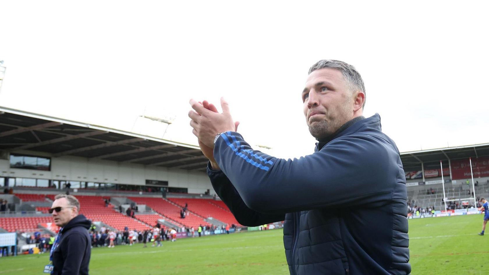 Warrington boss Sam Burgess applauds supporters