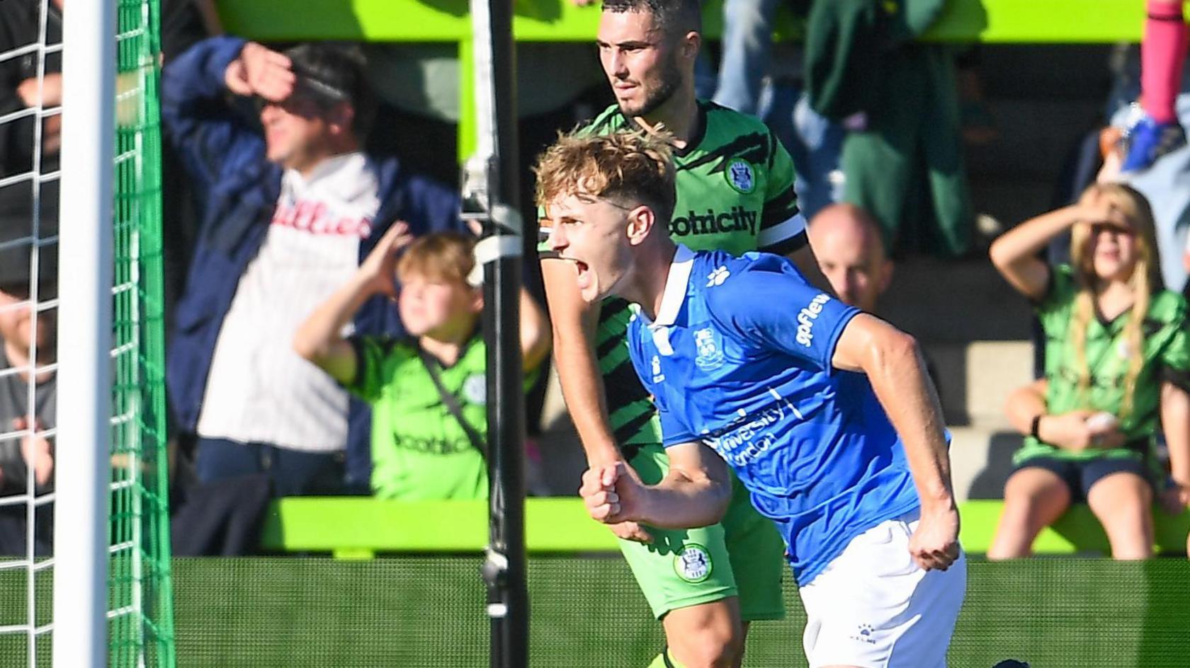 Callum McFarlane celebrates scoring a goal during his loan spell with Wealdstone