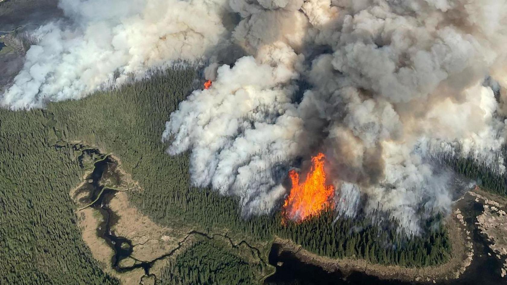 Smoke rises from the Kiskatinaw River wildfire in Canada.