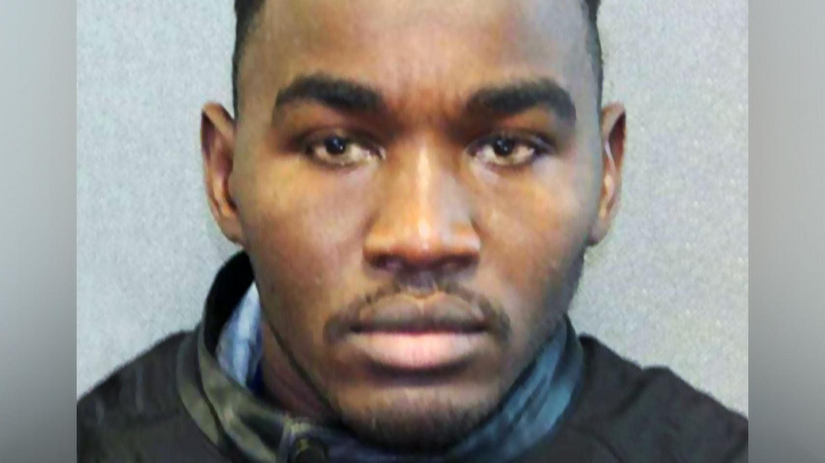 Headshot of Badreddin Abdalla Adam Bosh - a man with short, dark, hair and a short goatee beard, looking straight into the camera.