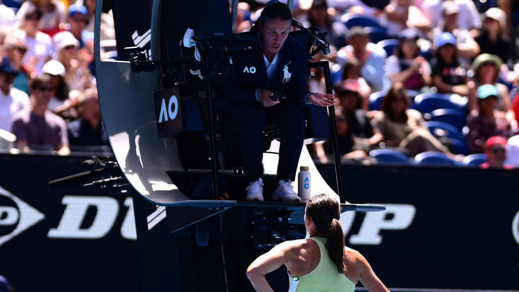 Emma Navarro asks chair umpire Eva Asderaki-Moore about the double bounce incident