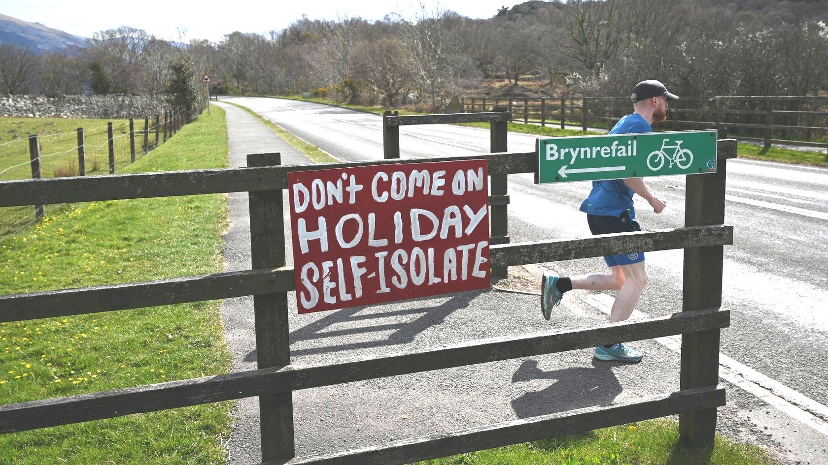 Sign in Llanberis, Snowdonia, urging people to stay at home