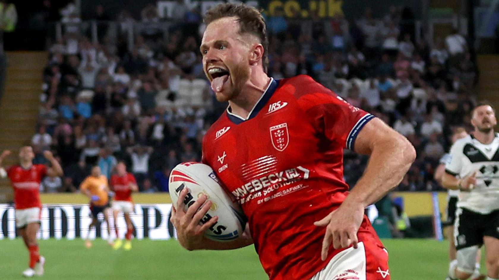 Joe Burgess crosses to score a try for Hull KR