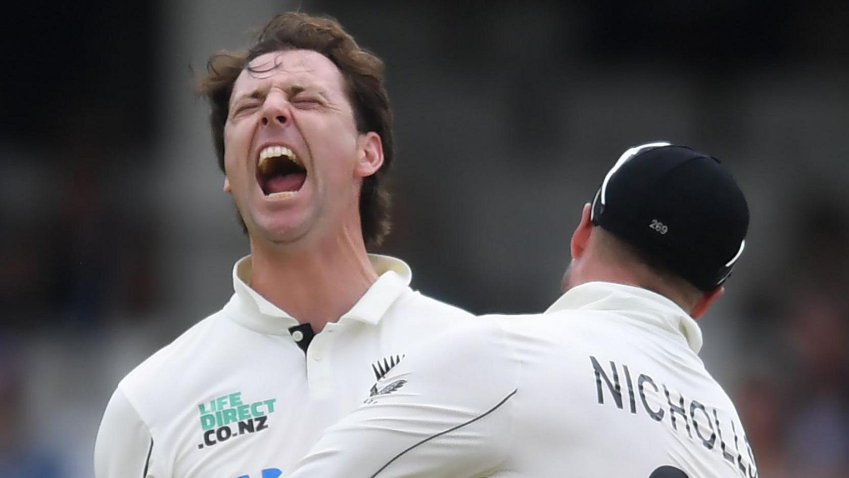 New Zealand bowler Matt Henry roars in celebration after taking a wicket