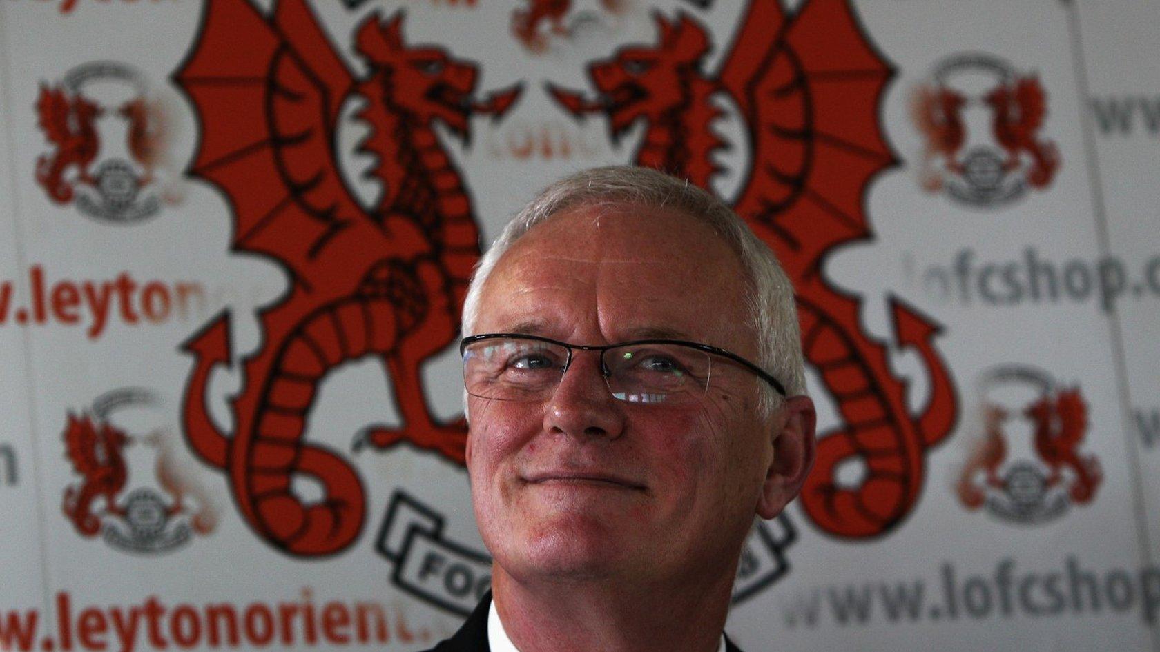 Barry Hearn in front of Leyton Orient crest