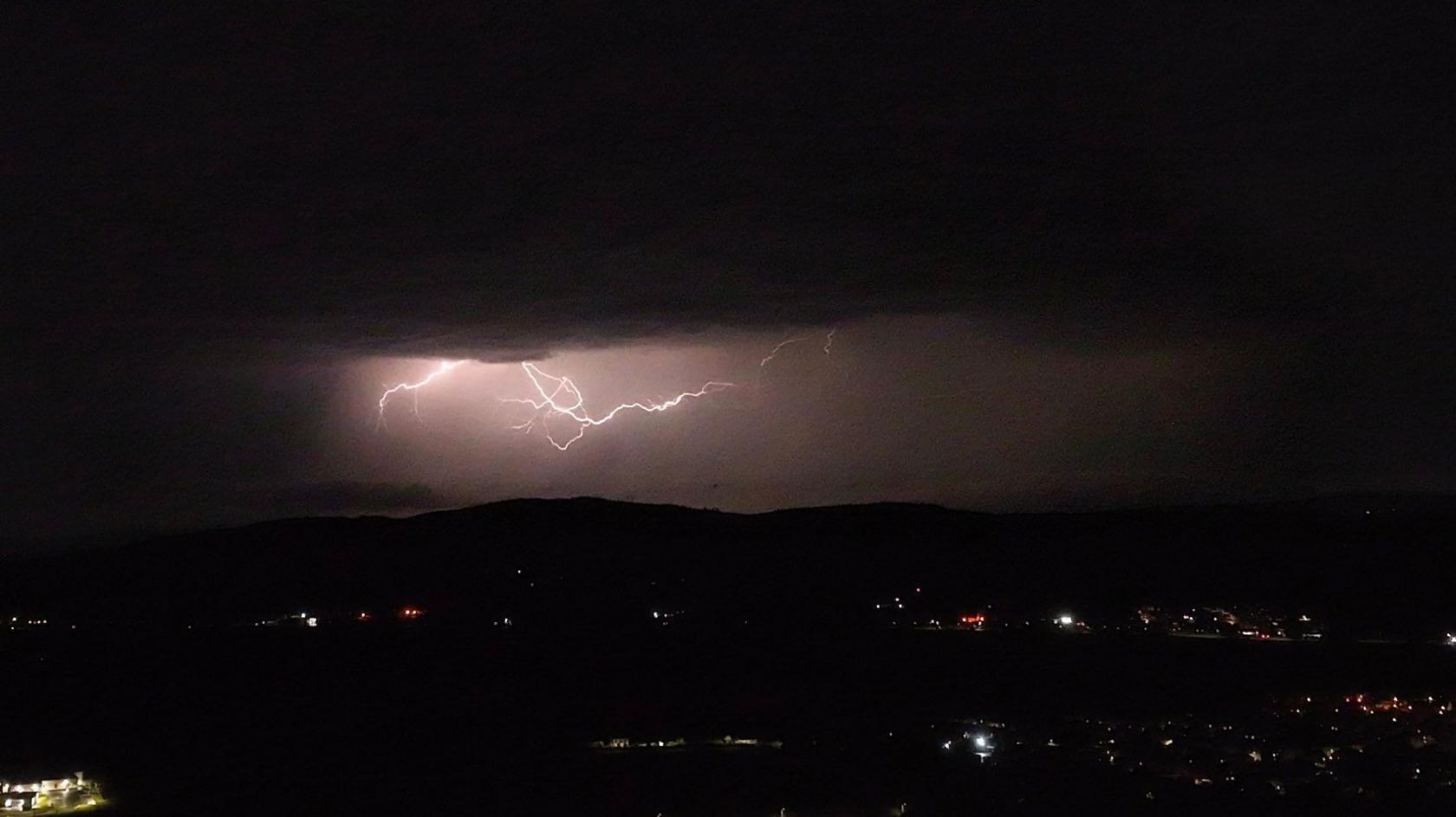 Lightning pictured in a dark night sky.