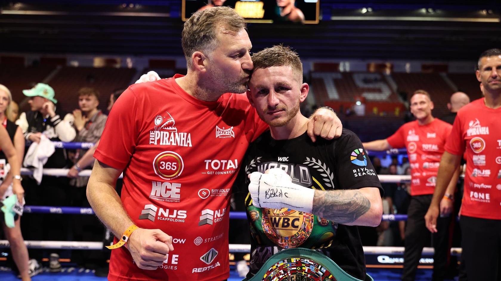Ryan Garner and Wayne Batten pose for a photo in the ring at St Mary's Stadium