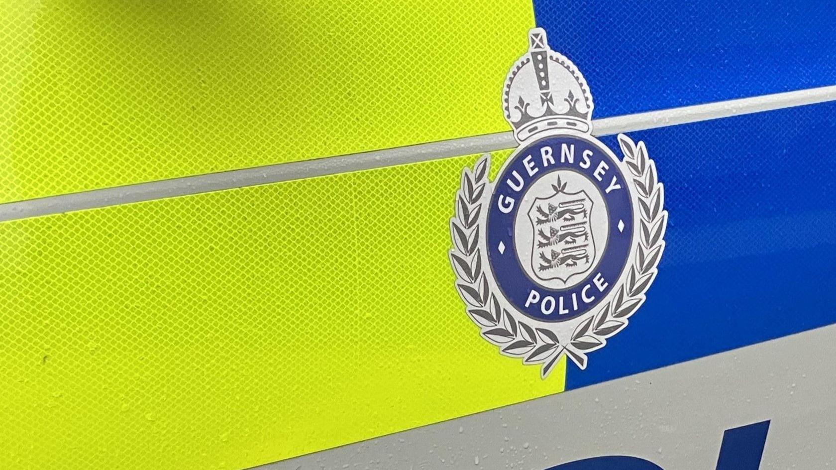 A Guernsey Police logo on the side of a car