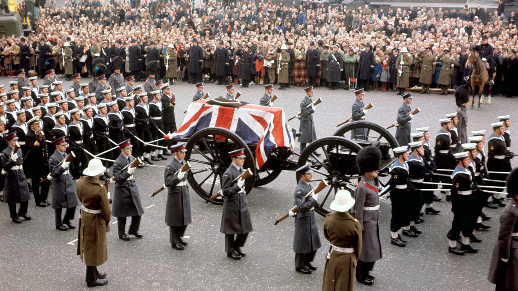 A close-up of the gun carriage carrying the coffin of Sir Winston Churchill crossing Trafalgar Square, London.