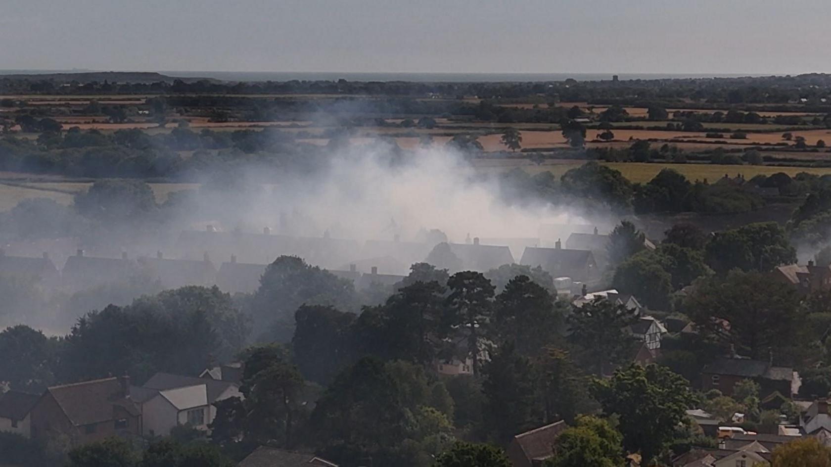 Drone footage of the Bockhampton fire. Smoke can be seen spreading above houses.
