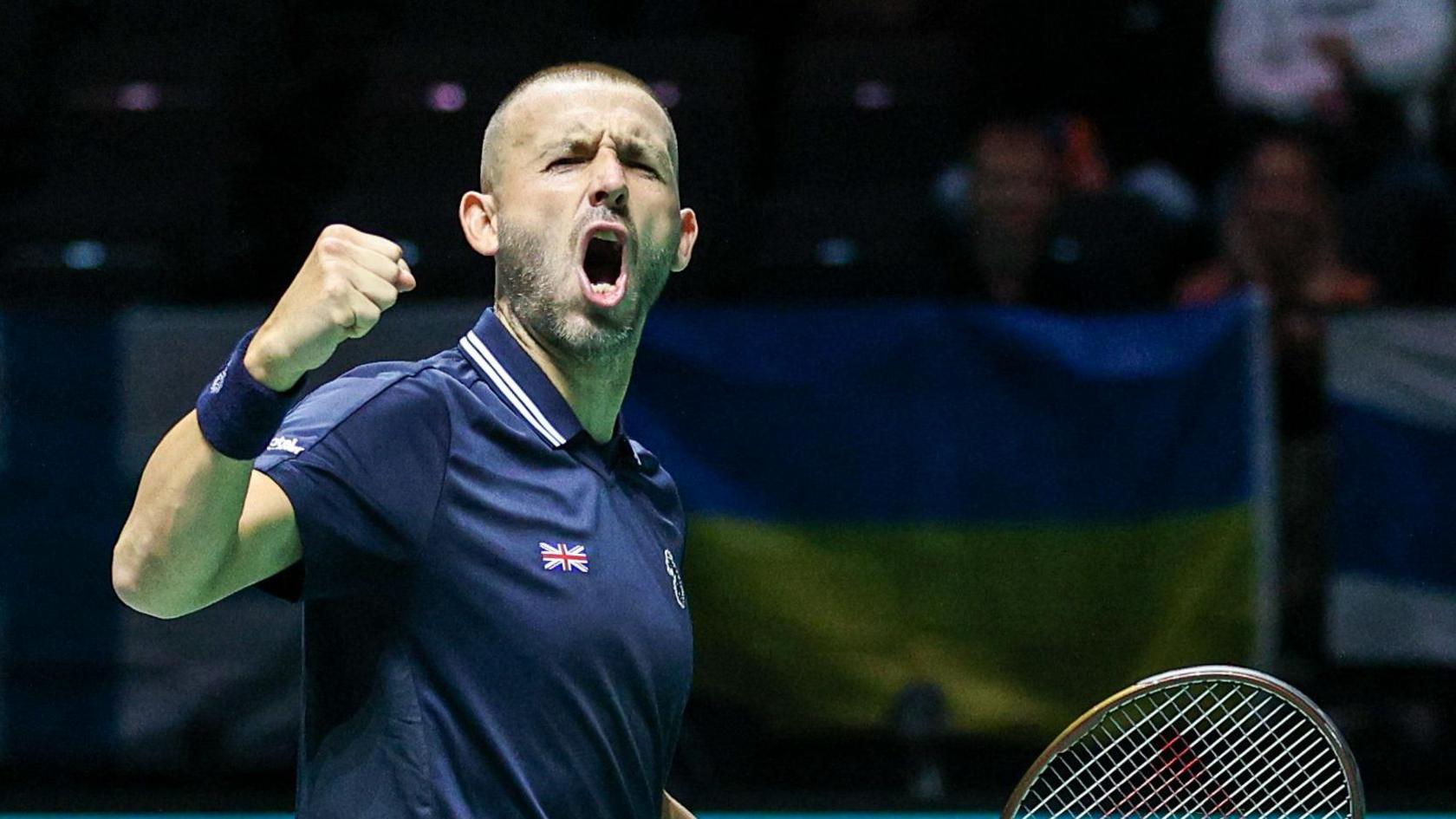 Dan Evans celebrates during his Davis Cup win against Finland