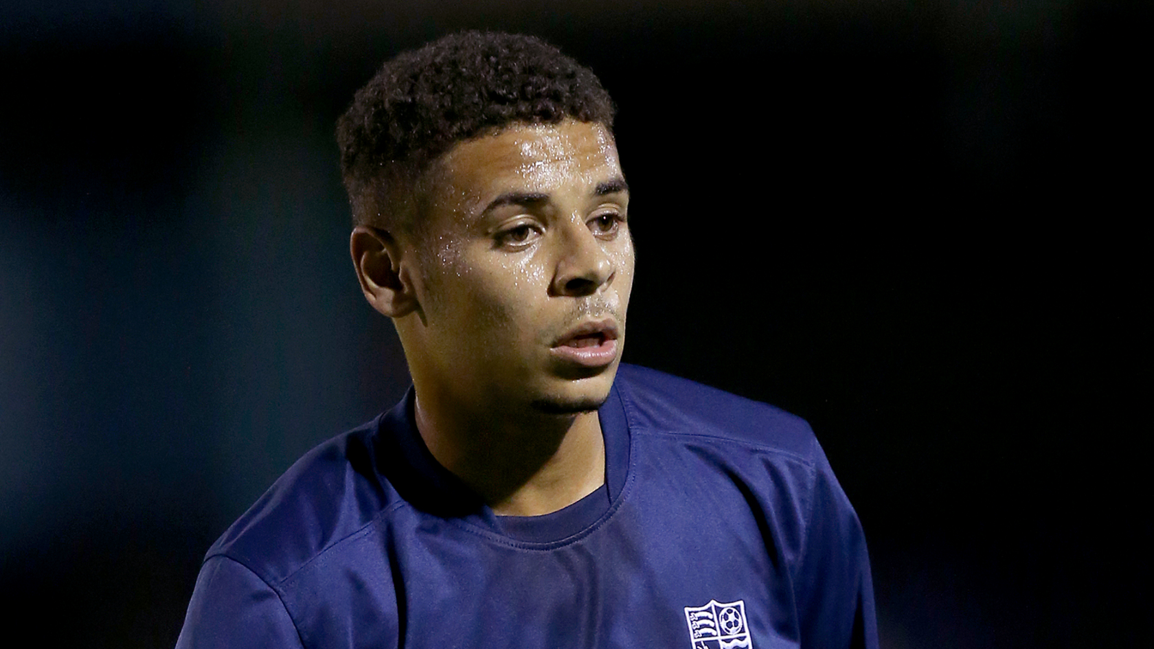 Chiedozie wearing a blue Southend United shirt. 