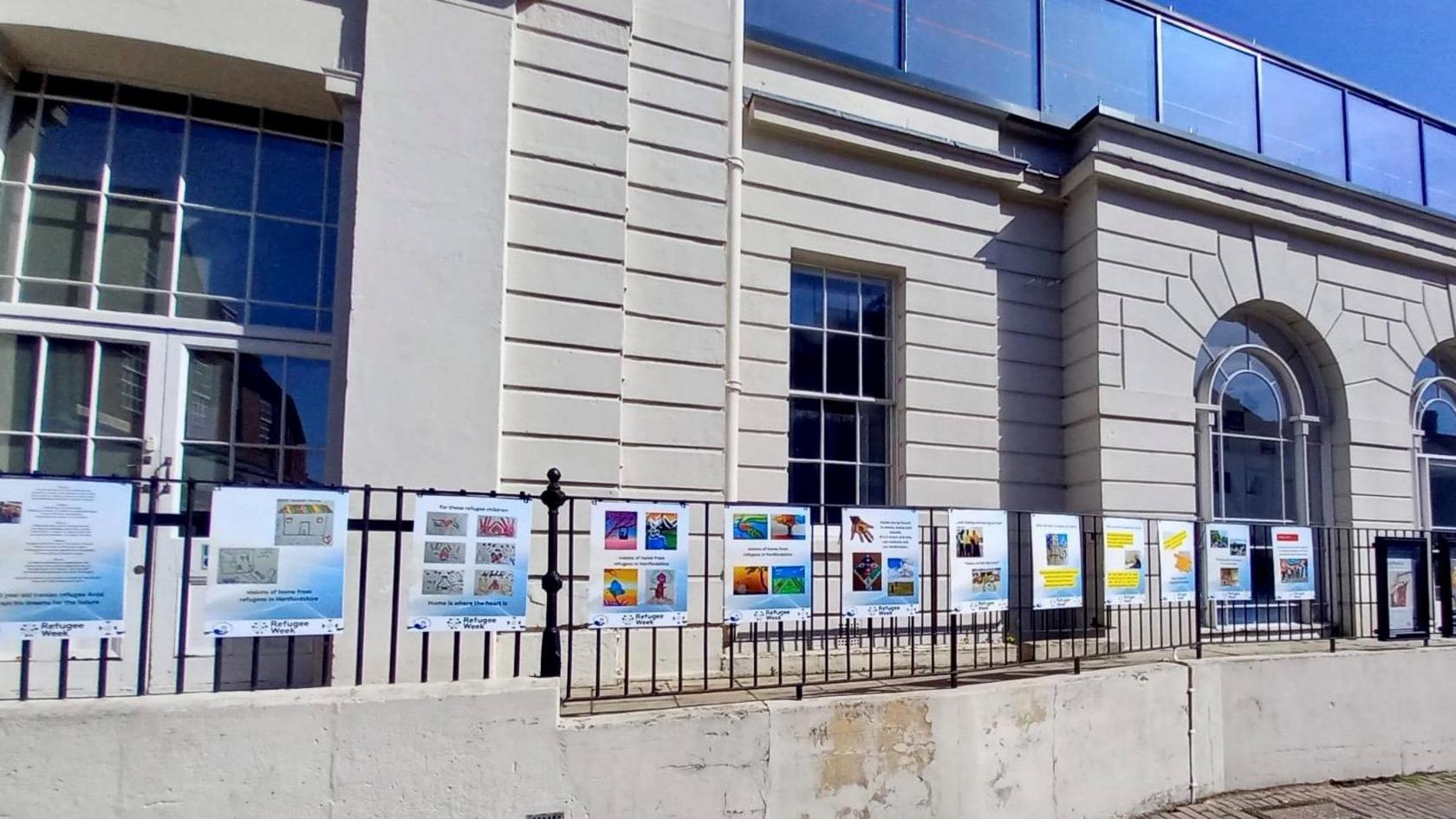 St Albans Museum + Gallery with images from the display attached to its outside railings