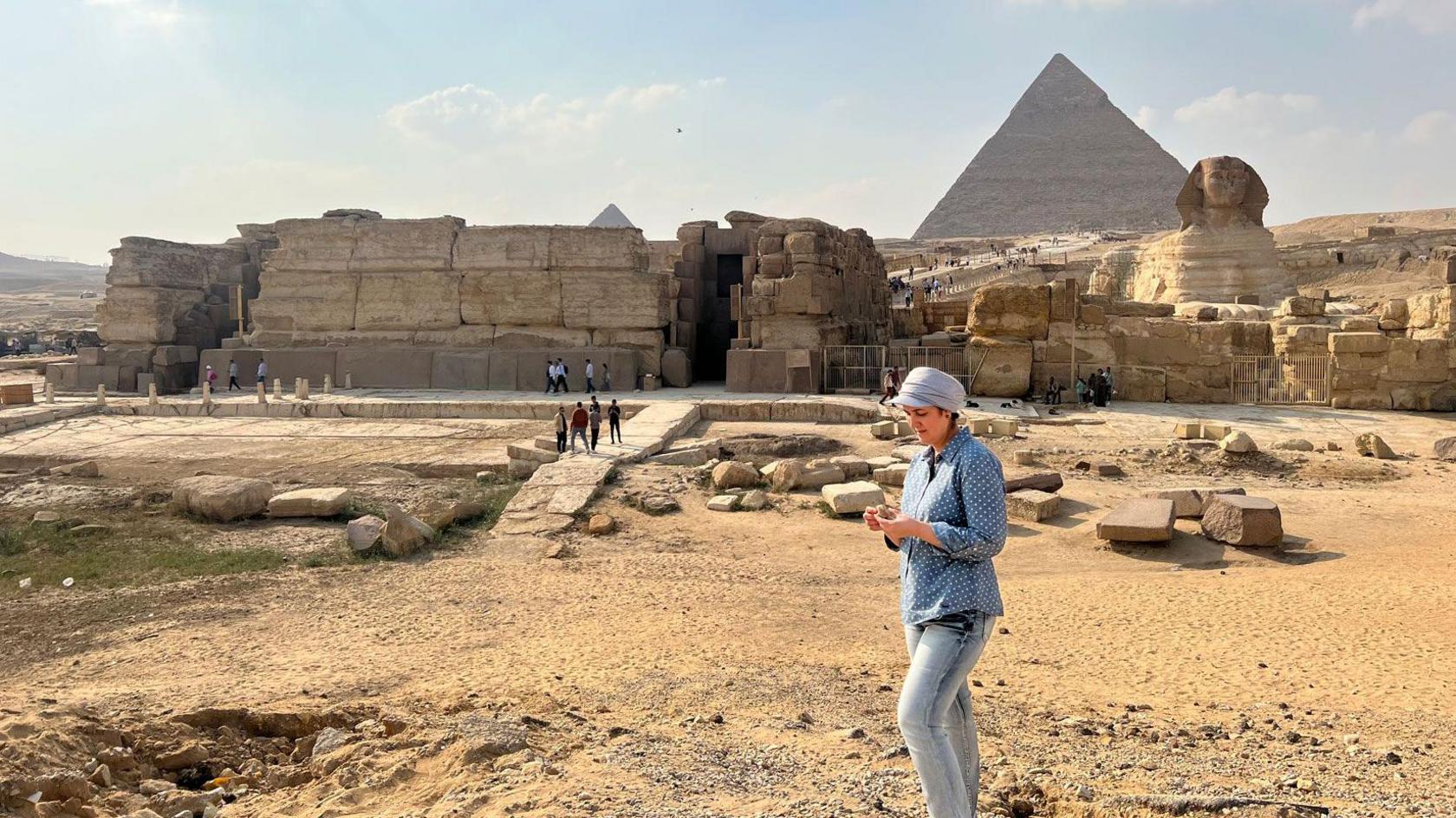 UNCW Professor Eman Ghoneim studies the surface topography of the section of the ancient Ahramat branch located in front of the Pyramids of Giza and the Great Sphinx. Photo Credit: Eman Ghoneim/UNCW