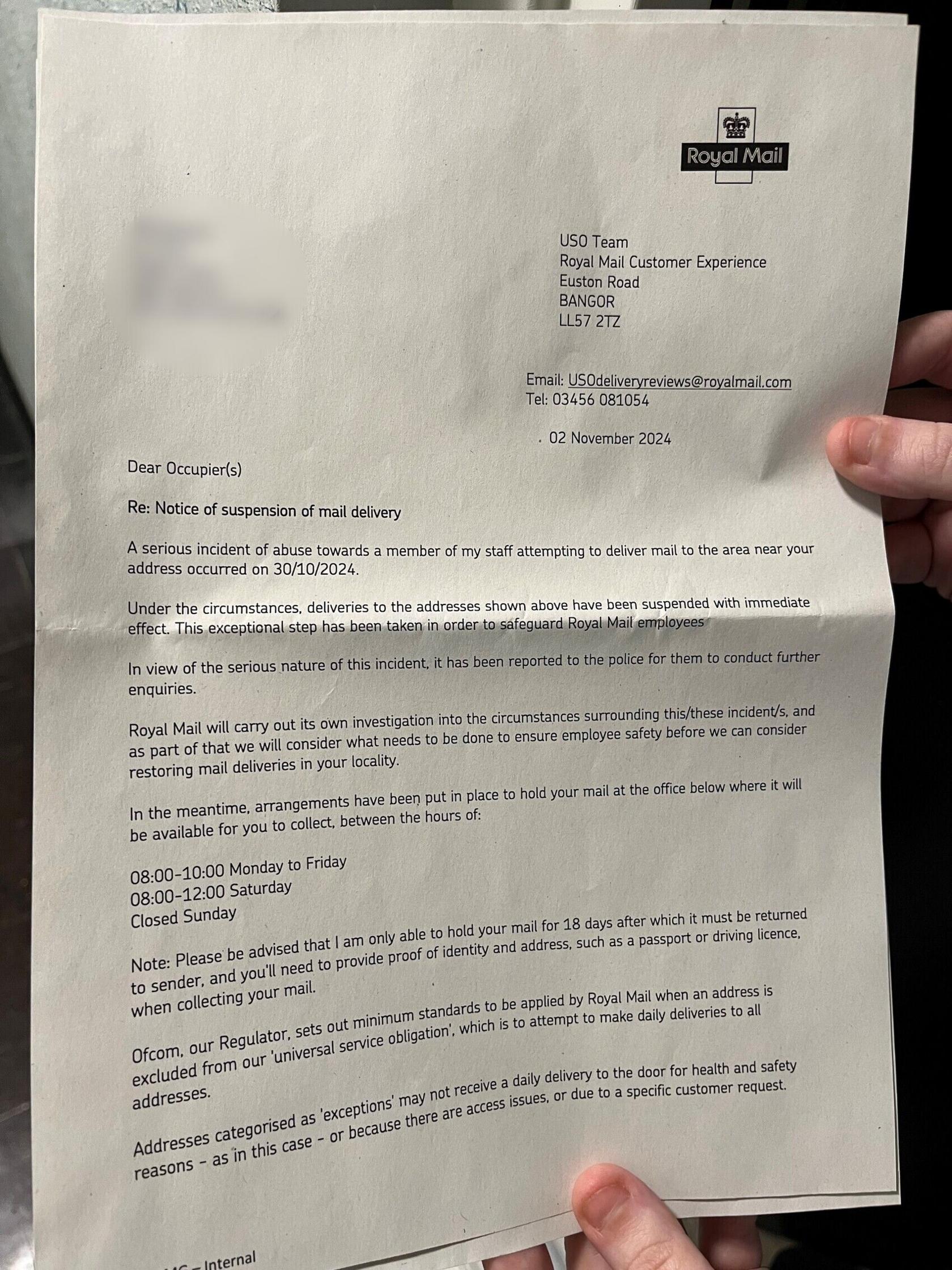 A letter on white paper. The text is in black. A finger can be seen holding the letter at the bottom. The Royal Mail logo is in black and white in the top right corner.