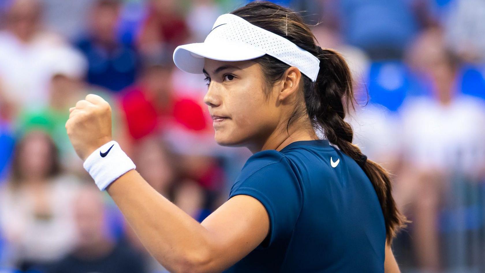 Emma Raducanu celebrates winning a point against Peyton Stearns in Montreal