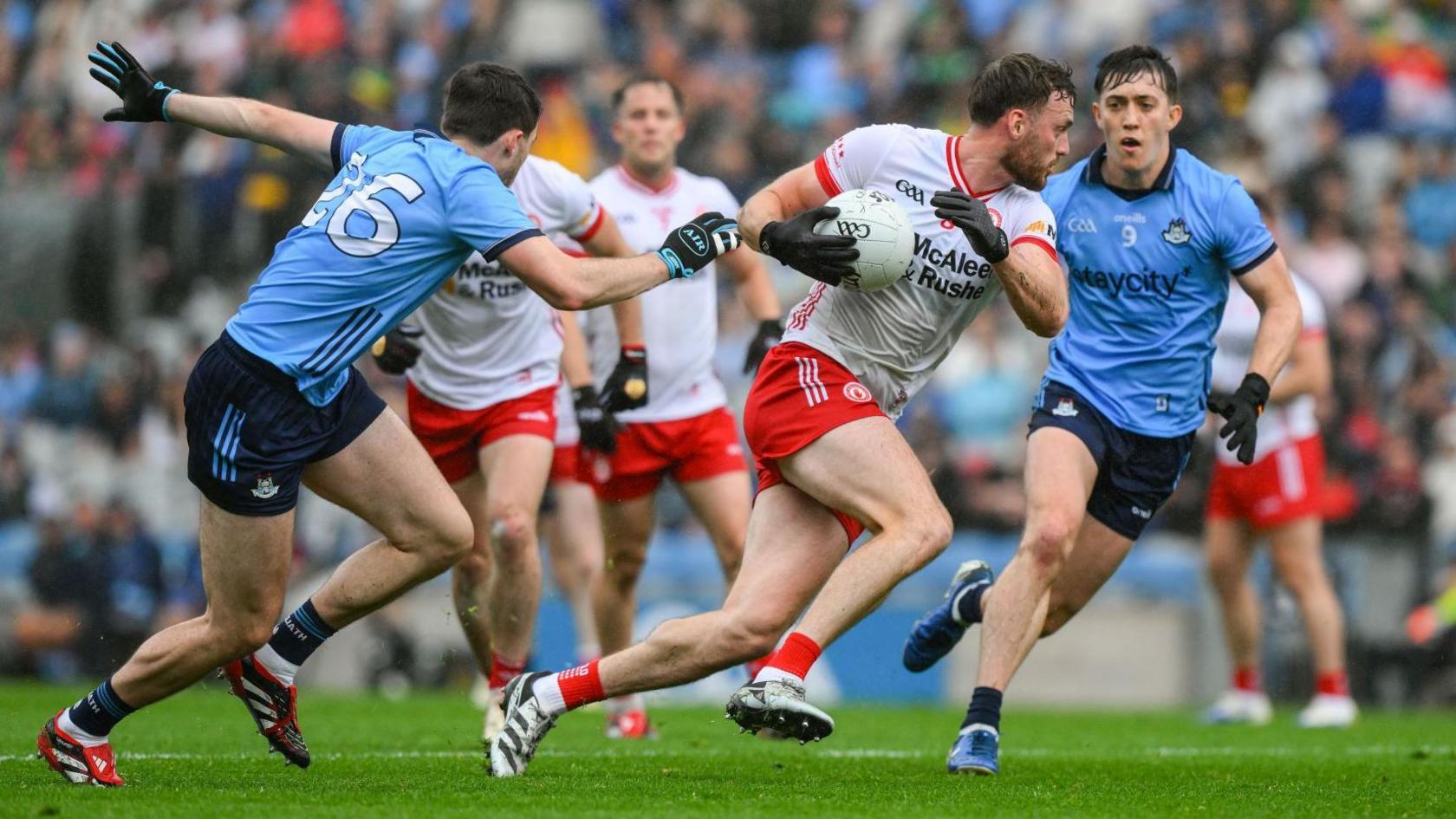 Tyrone's Brian Kennedy escapes a tackle