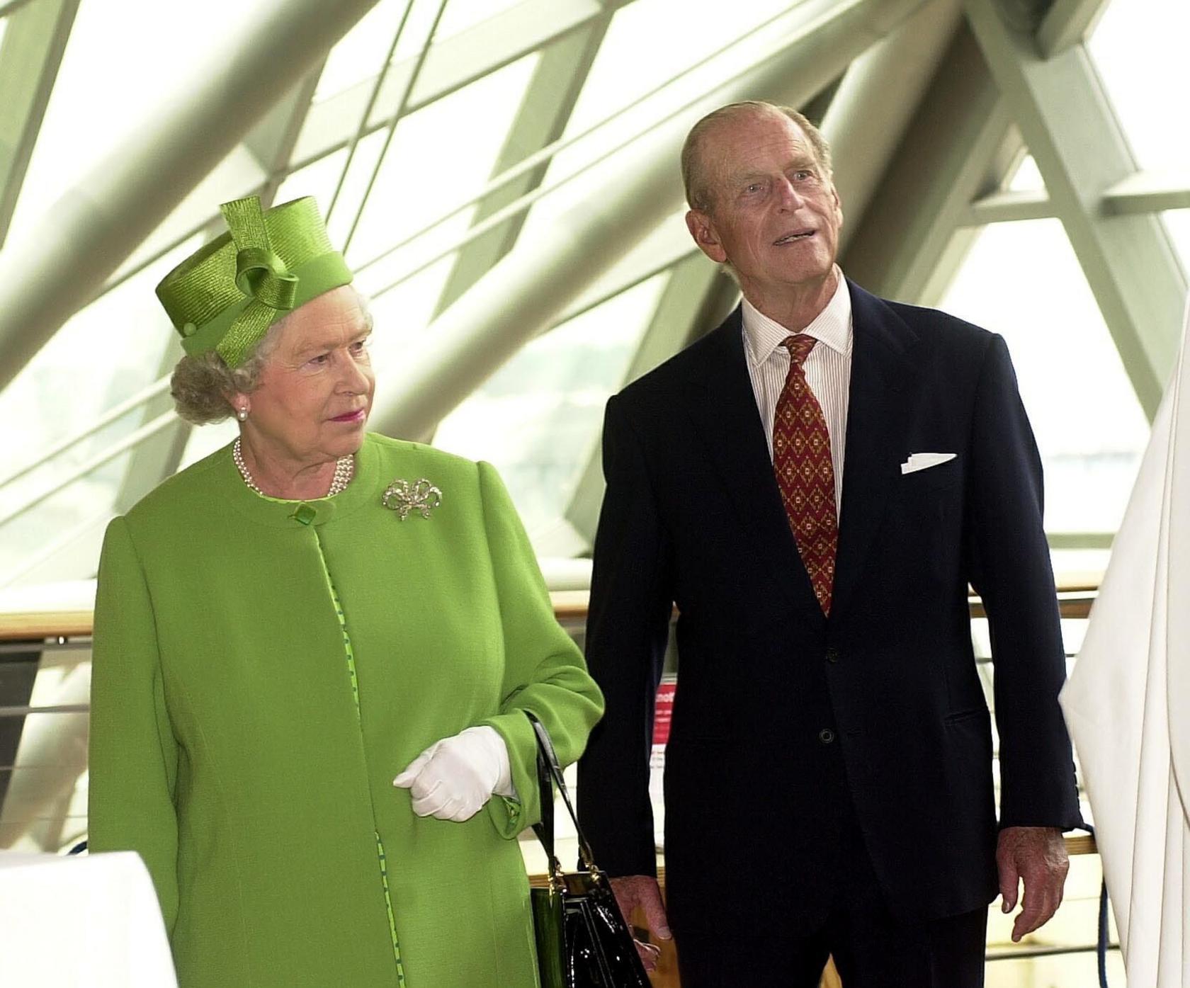 Queen Elizabeth II and the Duke of Edinburgh look at the exhibits during their visit to the Science Museum in Glasgow, Scotland.