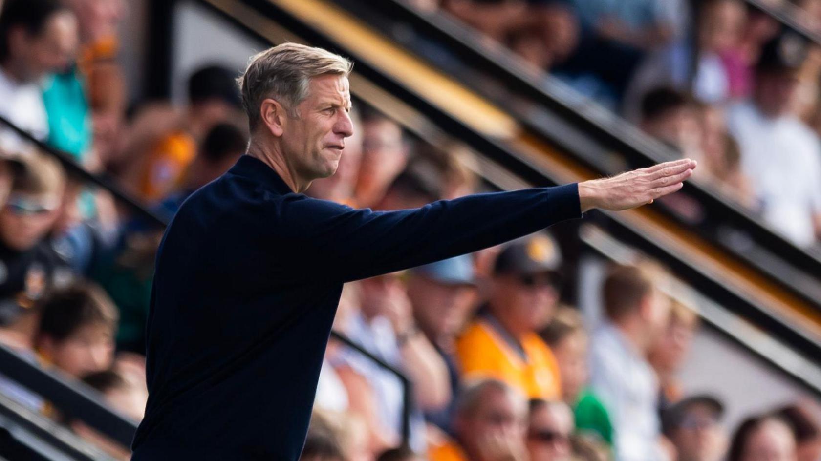 Newport County manager Dave Hughes gives instructions from the touchline