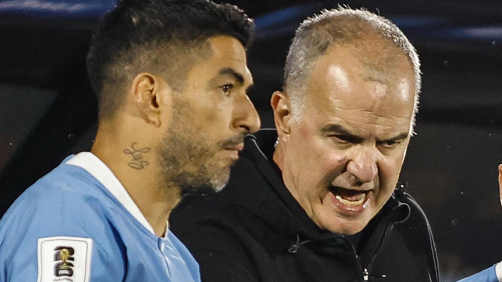 Luis Suarez listens to instructions from Marcelo Bielsa